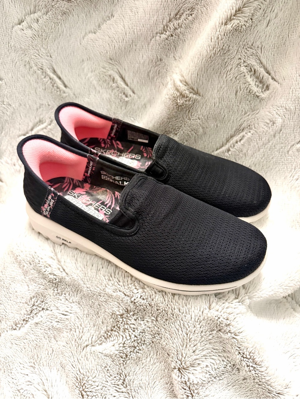 Skechers Slip-On GOwalk Sneakers in Black with Pink Lining